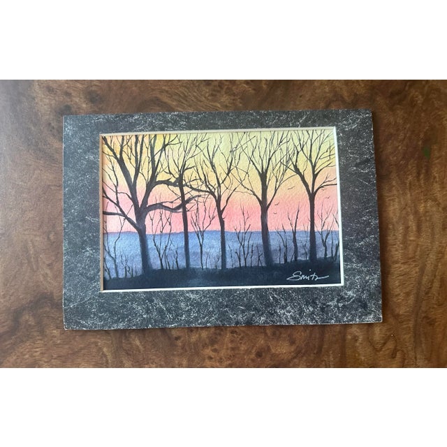 Trees silhouetted against a twilight sky. Signed and matted.