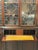 Impressive antique english display cabinet with integrated secretaire desk, combining elegant showcase storage with a...