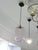 Elegant vintage blown glass pendant light with a simple, timeless design. The transparent, subtly pink-tinted glass shade...