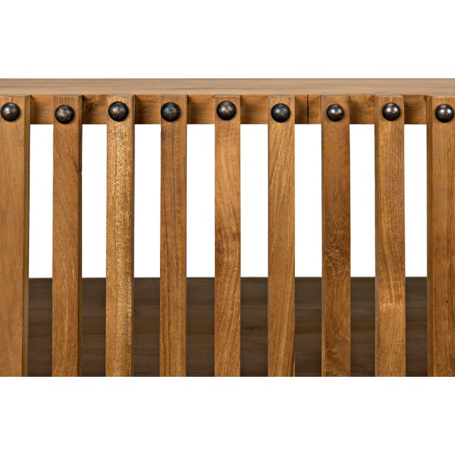 Subtly tropical and substantially stylish, this teak console has a natural finish that allows the woodÕs beauty to shine....