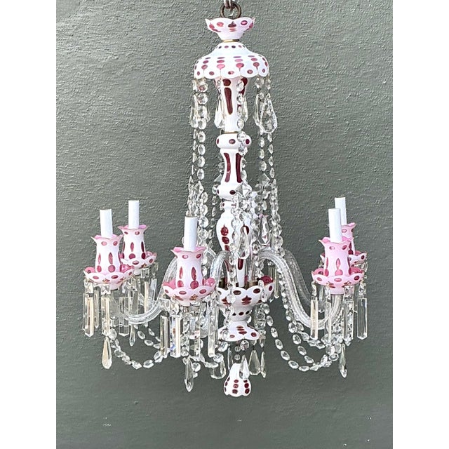 This exquisite vintage Bohemian chandelier is a masterpiece of cut-to-clear artistry, featuring a stunning interplay of...