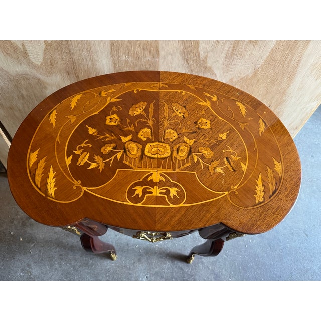 A refined vintage French Louis XVI style commode dating from around 1980, beautifully crafted from mahogany with elegant...