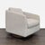 This West Elm lounge chair features a soft, textured beige fabric and a sturdy swivel base. Its thick cushion and...