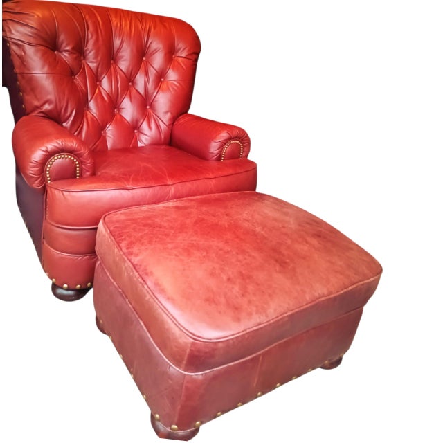 Upholstered in vibrant red leather, this set features classic design elements: Elegant Details: Deep button tufting on the...