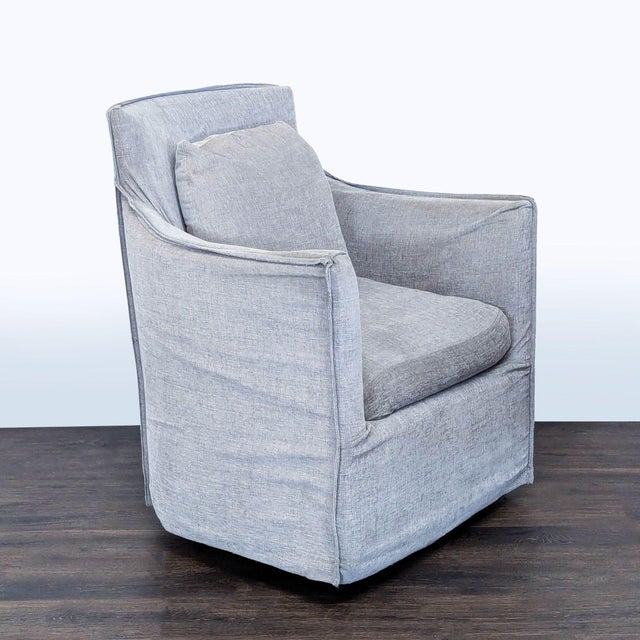 Add a touch of modern comfort to your space with this Restoration Hardware lounge chair. Featuring a smooth swivel base...