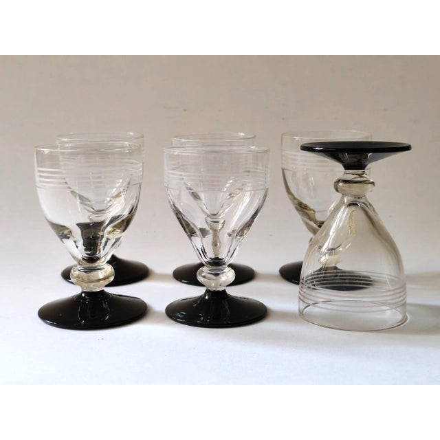Elegant vintage-style vodka and schnapps glasses from the Hørsholm series (produced 1942-66) by Holmegaard. Clear, blown...