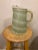 A distinctive 1960s Color Craft Corporation pitcher from the company's innovative Shat-R-Pruf line. The glass body is...