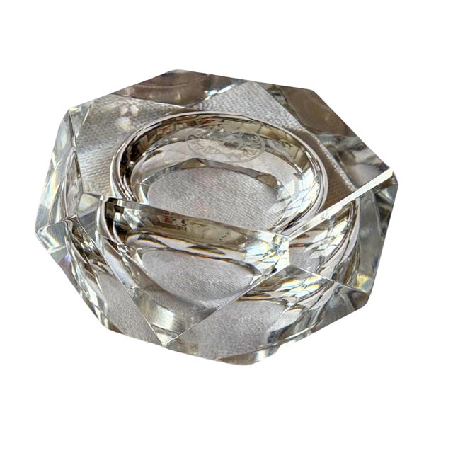 An elegant pair of Baccarat crystal salt cellars, beautifully cut in a geometric octagonal form that captures and reflects...