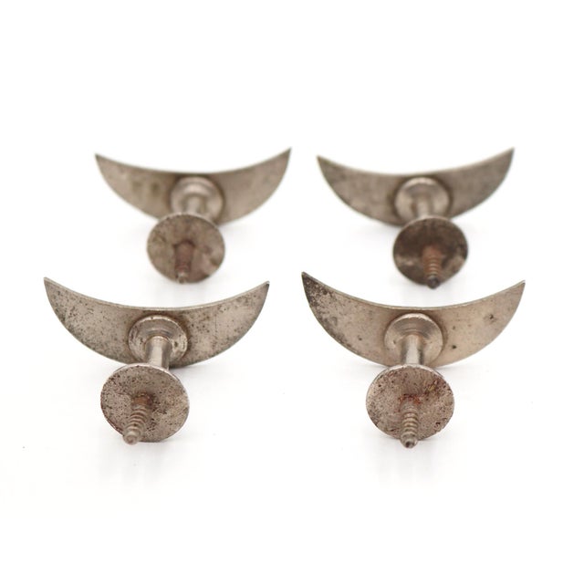 Vintage crescent moon shaped drawer or cabinet knobs made of nickel plated brass. The screws are attached to backs. Good...
