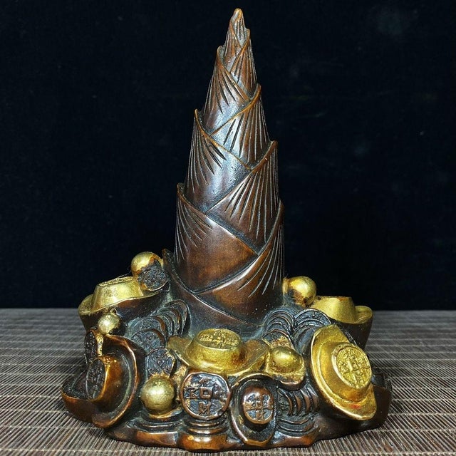 This is a striking vintage Chinese bronze sculpture, symbolizing prosperity and success. The central form is a large...
