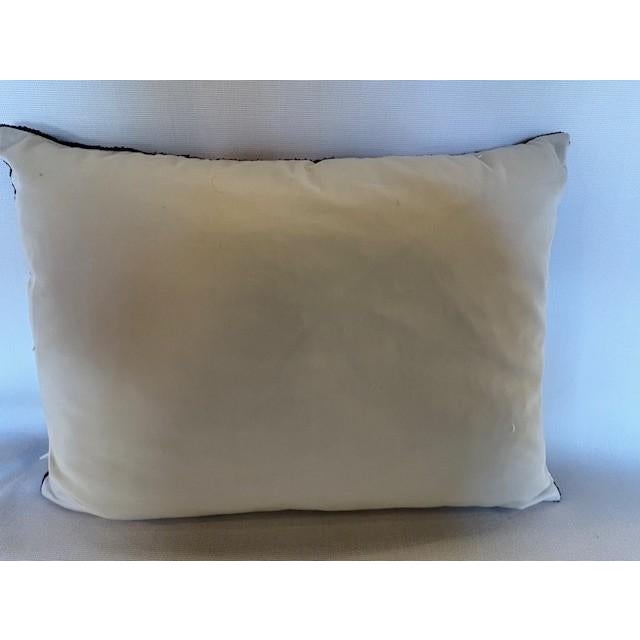 This dazzling pillow cover from Les Ottomans features a simple, black and white, geometric pattern on silk velvet. The...