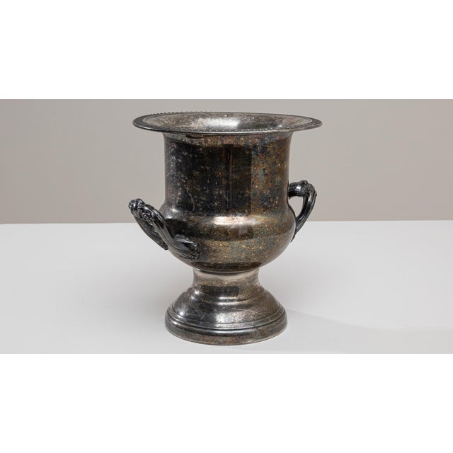 This 20th Century French silver-plated champagne bucket features a beautifully timeworn patina that highlights the...
