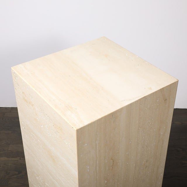 This substantial Mid-Century Rectilinear Travertine Pedestal originated in Italy, circa 1970. Carved from pale ivory-beige...