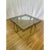 Attributed to Brueton stainless steel cocktail table has modern angular lines with a complimentary glass table top....