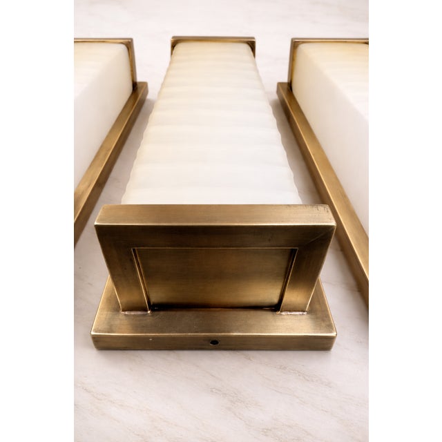 Elevate any interior with these striking Textured Glass and Brass Wall Light Columns, a perfect blend of timeless elegance...