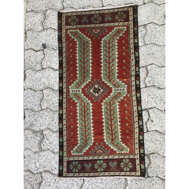 This is a vintage Turkish Oushak rug from the 1960s. The piece was hand-knotted.