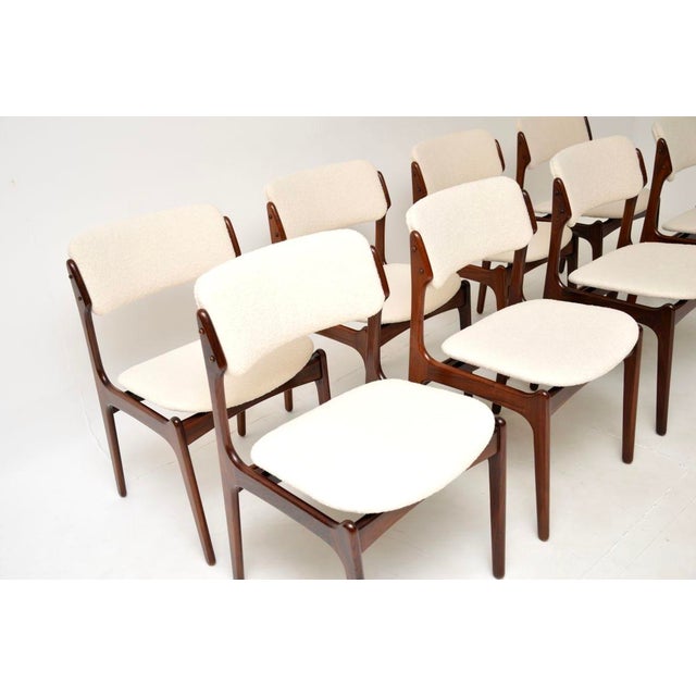 A superb set of eight Danish vintage dining chairs by Erik Buch. They were made in Denmark, they are the model 49 chair...