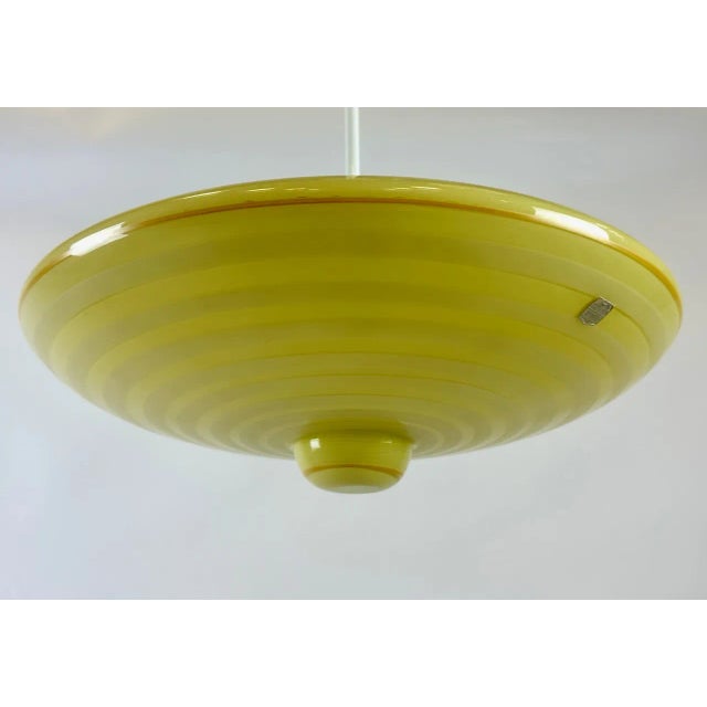 Space Age UFO Glass Pendant Lamp from Meissen, 1950s, in Very Good conditions. Designed 1950 to 1959 This piece has an...