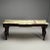 A grand French mahogany and parcel-gilt console table, circa 1940s. The shaped onyx marble atop a serpentine-shaped...