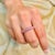 This is part of Chairish’s Fine Jewelry assortment. Natural Pink Sapphire Thick Eternity Band Pave Ring in 18K Gold...