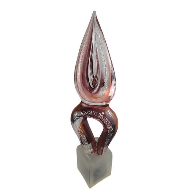 Gorgeous hand blown Italian glass sculpture from the Island of Murano. Heavy glass tear drop shape that sits atop a white...