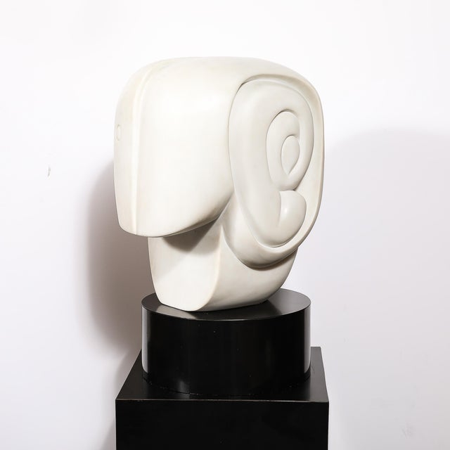 This monumental and beautifully carved Mid-Century Modernist White Marble Amorphic Sculpture on Rotating Base and Black...