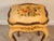 Finished in a warm mustard-yellow ground, the piece is decorated by hand with colorful floral bouquets, scrolling accents...