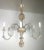 This traditional Italian style chandelier features a central column adorned with a pineapple-like top finial, adding a...