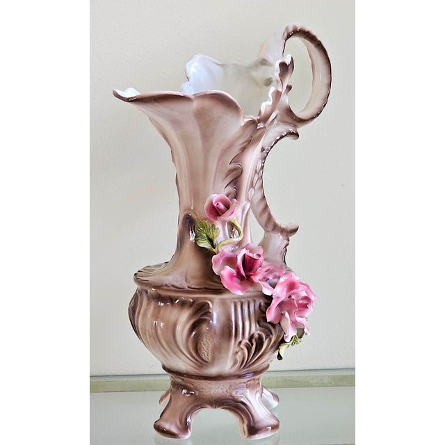 Elegant vintage Italian Capodimonte-style porcelain pitcher or ewer, dating to approximately the 1960s–1970s. This...