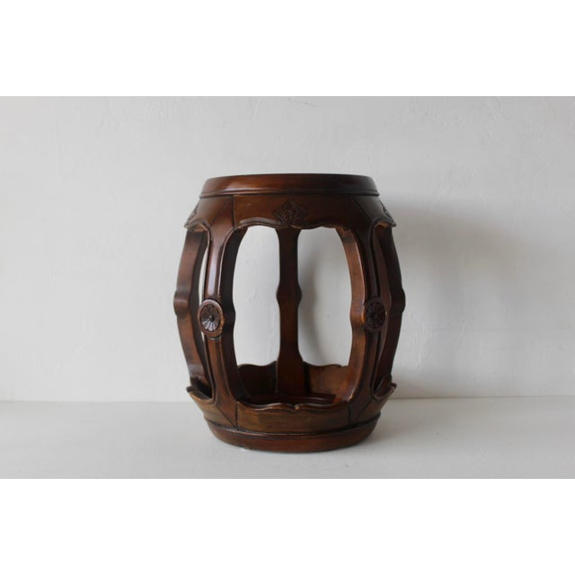 Vintage Asian wood and granite barrel stool, featuring a carved drum-shaped design commonly associated with the Ming or...