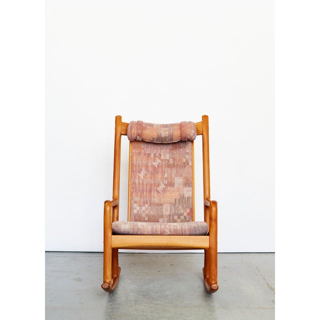 Rocking chair by hans olsen with teak frame and upholstered fabric. very good condition. the dane hans olsen was an...