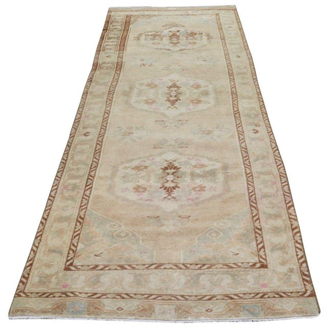 Hand-knotted with care using traditional rug-making techniques, this wool rug blends timeless craftsmanship with a modern...