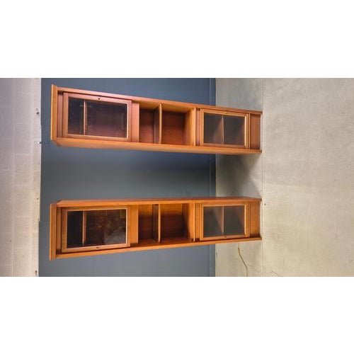 Pair of beautiful and elegant book shelves/display cabinets by Giorgetti. The cabinets each have two doors and an...