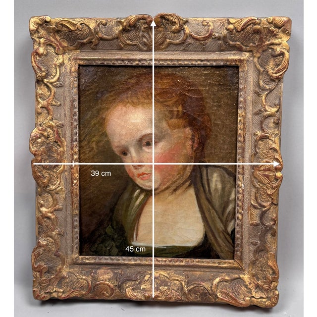 Small portrait of a young girl, painted in three-quarter view, canvas mounted on cardboard in a period carved and gilded...