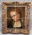 Small portrait of a young girl, painted in three-quarter view, canvas mounted on cardboard in a period carved and gilded...