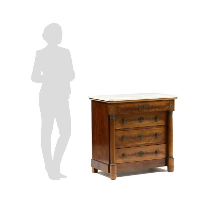 20th century, rectangular white marble top, mahogany, mahogany veneered case with four drawers flanked by fully turned...