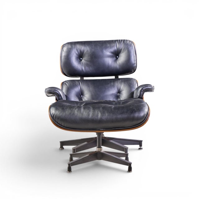 Charles and Ray Eames for Herman Miller Mid Century Rosewood Eames Chair and Ottoman The chair measures: 34 wide x 32 deep...