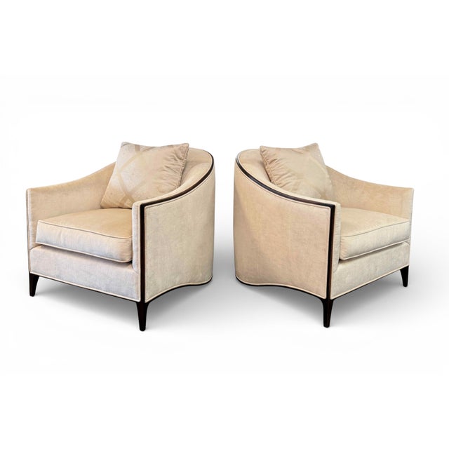 A pair of gorgeous Ambella Atelier Lounge Chairs. Features Art Deco-inspired lines with swooping side rails to create a...
