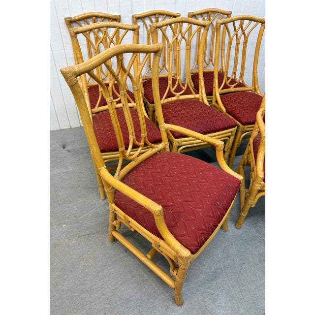 This listing is for a set of Vintage Faux Bamboo Rattan Dining Chairs. Featuring two arm chairs, six side chairs, faux...