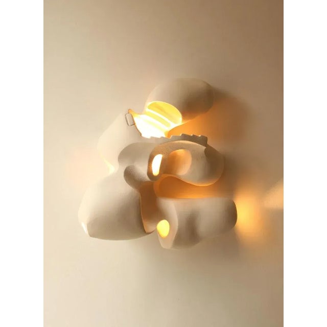 Tension lamp by aoao dimensions: w 48 x d 42 x h 20 cm. Materials: ceramic bisque introducing 'tension' – an illuminating...