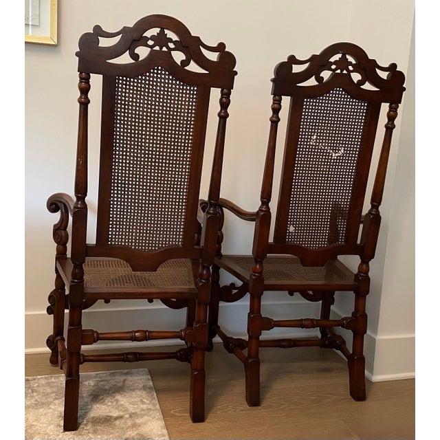 Pair of Large antique carved oak throne chairs. Cane back and cane seat. Carved edge arms and legs. Intricate high back...