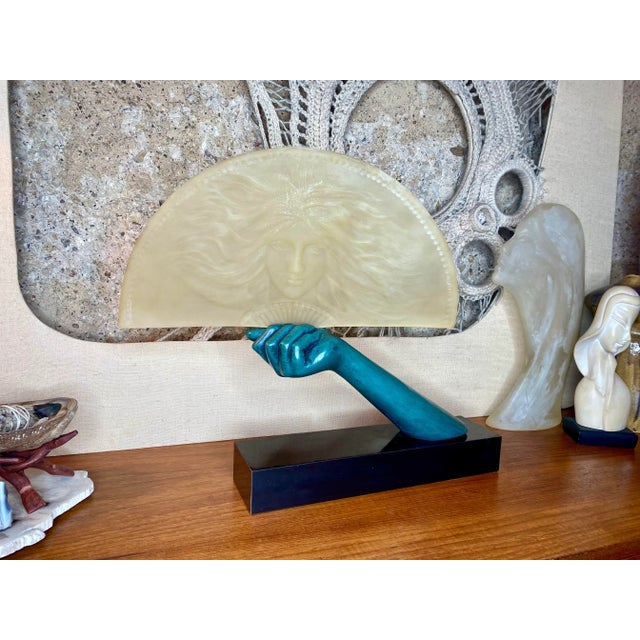 This Austin Sculpture has an Art Deco female face with flowing hair imprinted in the frosted lucite fan that pops when...
