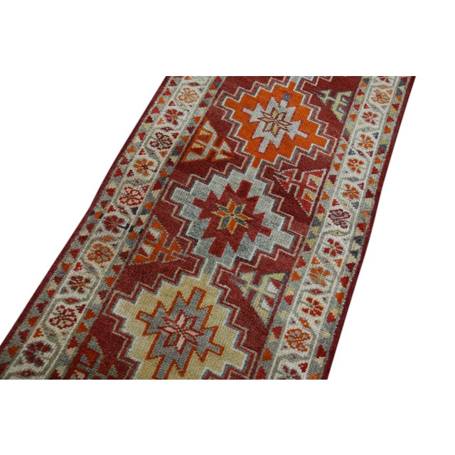 Introducing a one-of-a-kind vintage Turkish hand-knotted wool rug, carefully crafted by skilled artisans using traditional...