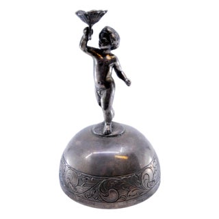 Silver Bell with Floral Motifs and Putti Holding Flower For Sale