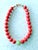 Stunning coral necklace with antique carved jade center bead. 19” with gold tone S hook clasp. Spring Summer collection by...