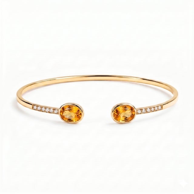 Add a touch of timeless elegance to your jewelry collection with this beautifully crafted Oval Citrine Open Cuff Bracelet....