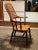 Large Victorian Windsor Armchair in solid elm, 19th century, with high back -shaped backrest. Large seat in turned wooden...