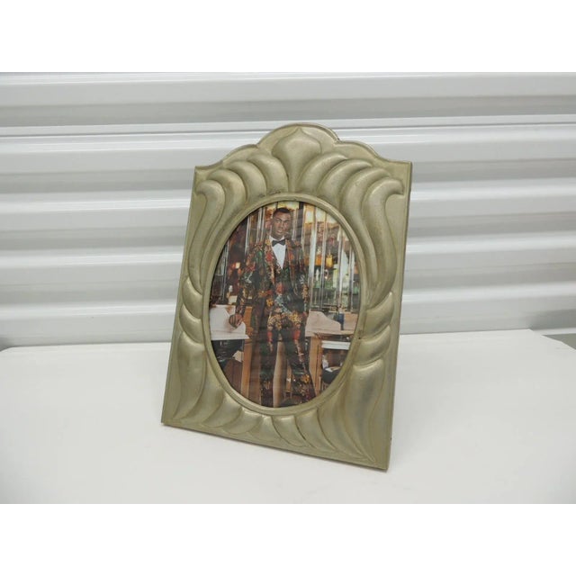 Large vintage tin sheet metal picture frame, Tin repousse on wood base and wood backing. Inset original glass window. The...