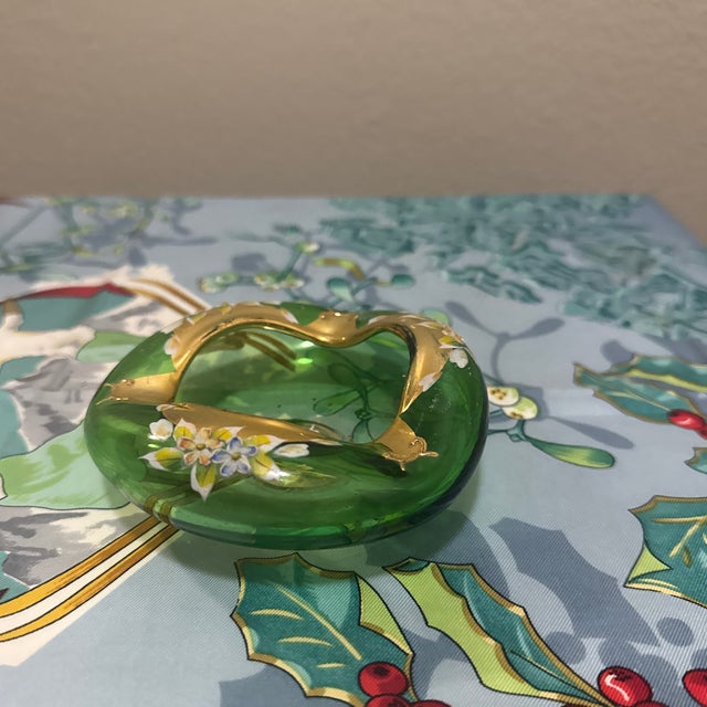 Add a touch of Mid-Century elegance to your home with this stunning vintage ashtray. Crafted from rich emerald green...