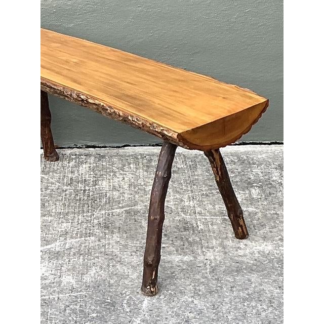 This exceptional vintage split log bench captures the raw beauty of the natural world, perfectly aligning with Adirondack...